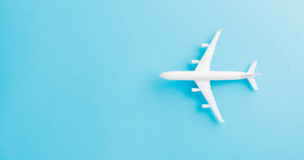 istock Top view flat lay of minimal toy model plane, airplane 1255735804