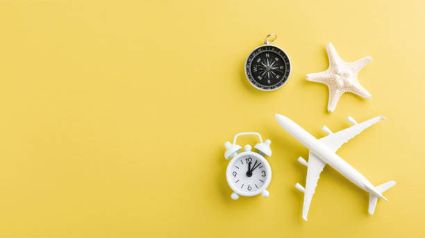 istock model plane, airplane, starfish, alarm clock and compass 1255735805
