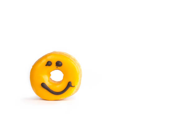 Fresh yellow donut with a chocolate smile