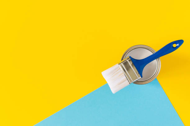 istock Can of white paint with a brush 1255737679