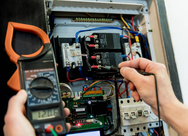 istock The man is repairing the switchboard voltage with automatic switches. 1255740738