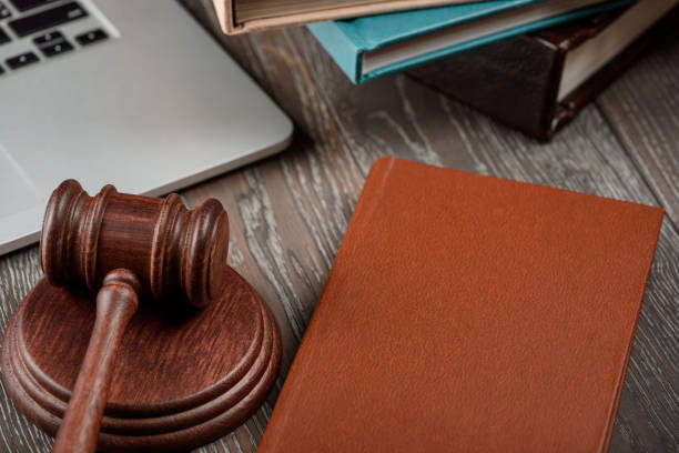 istock A gavel on a sound block, books and a laptop 1255742043