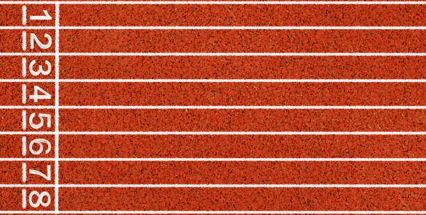 istock Running track with white lines and numbers from top view. 1255744357