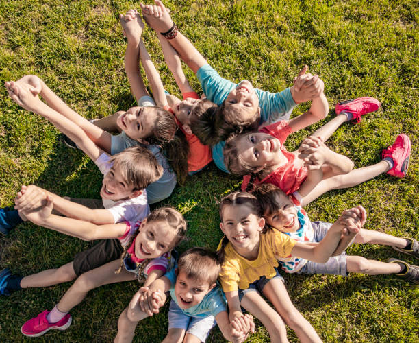 istock Above view of children sitting in circle 1255744676