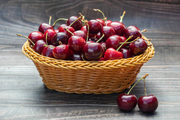 istock Ripe cherries in a wicker basket 1255748039