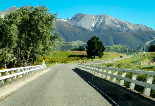istock bridge and road to mountain 1255754930