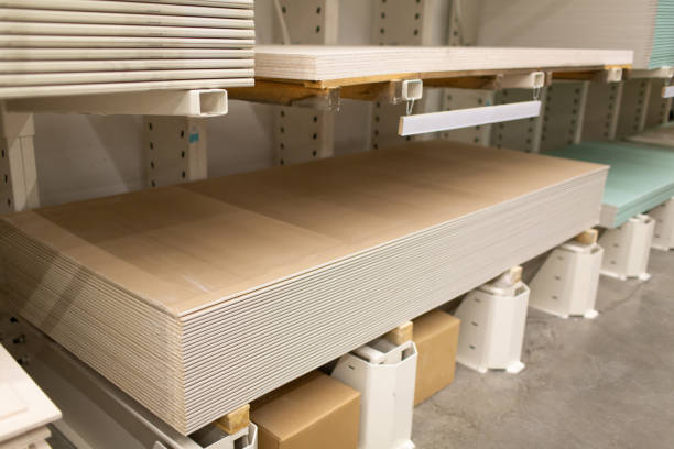 istock Pallet with Drywall sheets plasterboard in the building warehouse store. 1255756140