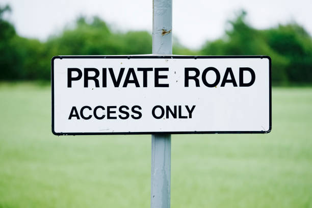 istock Private road access only sign in house development 1255756605