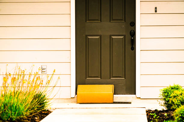 istock Cardboard Box Left on Doorstep during Covid-19 Pandemic stay at home orders 1255757617