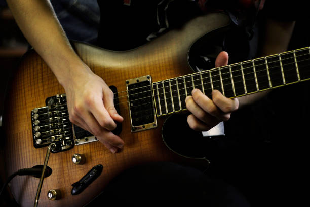 istock Person playig concert on a guitar. 1255757893