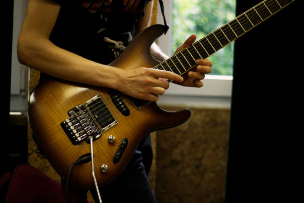 istock Person playig concert on a guitar. 1255757917