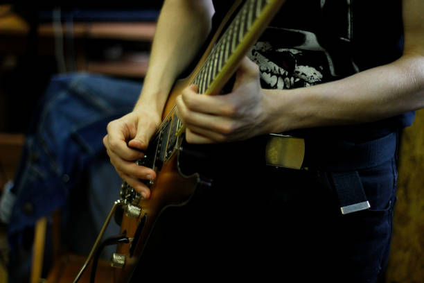 istock Person playig concert on a guitar. 1255759673