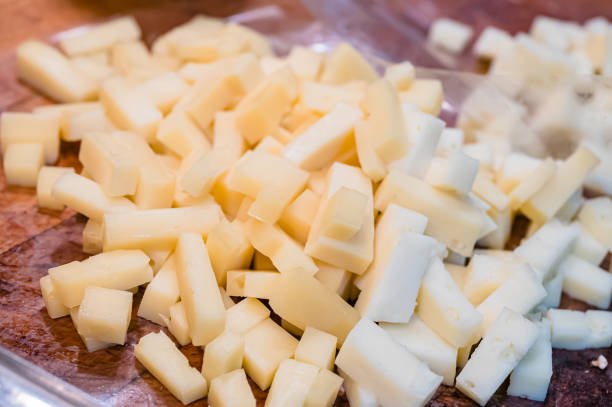 close-up of the typical cheeses used in the recipe for making pizzoccheri. typical dish from valtellina, lombardy, italy. - pizzoccheri homemade tagliatelle italy imagens e fotografias de stock