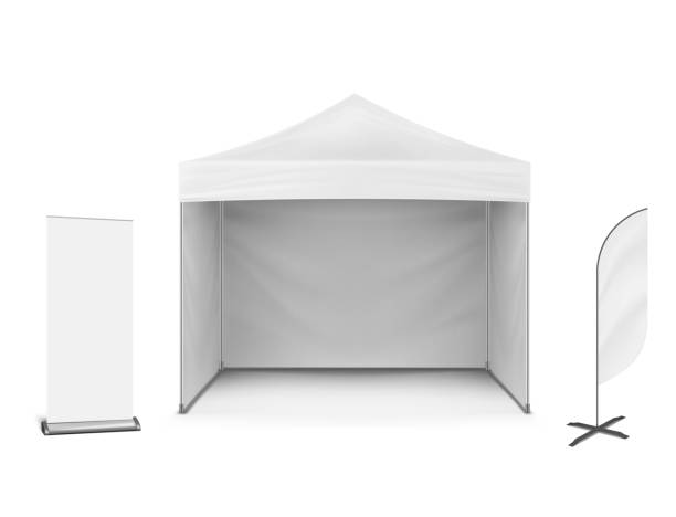 Pop-up marquee tent with event flag and roll-up banner stand, vector mockup. Exhibition set. Blank white template for business branding design Pop-up marquee tent with event flag and roll-up banner stand, vector mockup. Exhibition set. Blank white template for business branding design. feather flag stock illustrations