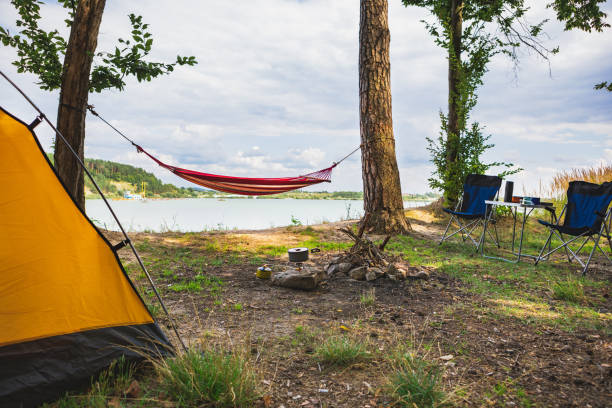 istock view of camping near lake with hammock between trees 1255763365