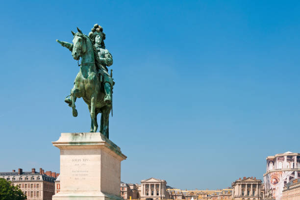 Château de Versailles : Louis 14 statue on the place, near the castle. It was an official residence of the kings of France and is now a World Heritage Site. Versailles, near Paris in France. April 30, 2019