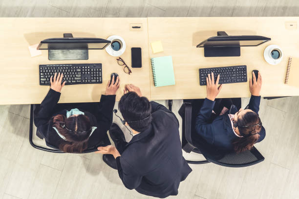 istock Business people wearing headset shot from top view 1255769067