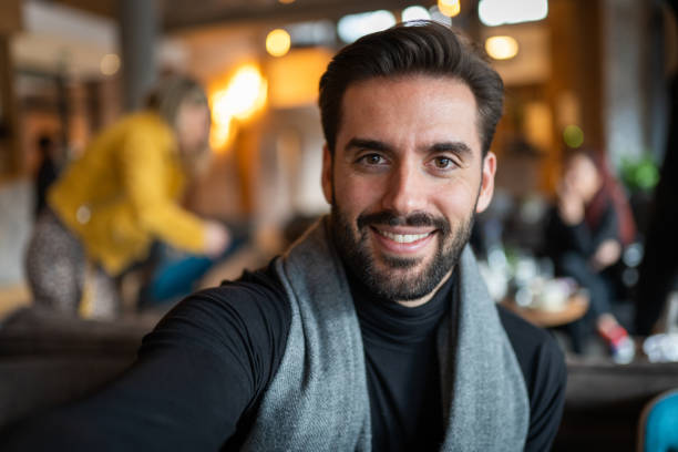 istock Selfie with mobile phone in coffee shop 1255773193