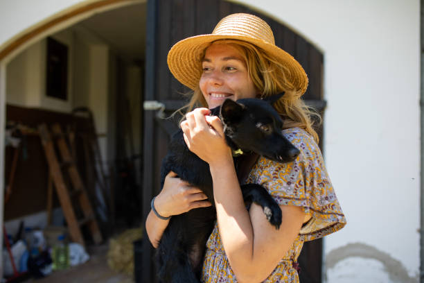 istock A woman happy while holding her dog 1255773530