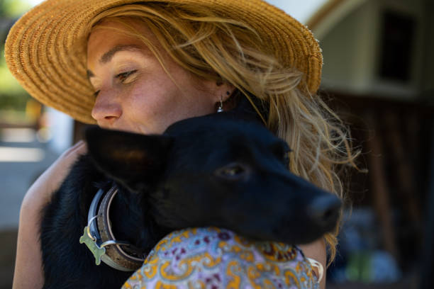 istock A woman enjoying a hug with her dog 1255773537