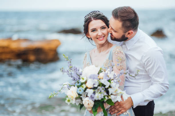istock same couple with a bride in a blue dress walk 1255774769