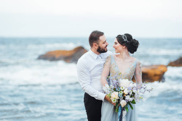 istock same couple with a bride in a blue dress walk 1255774967