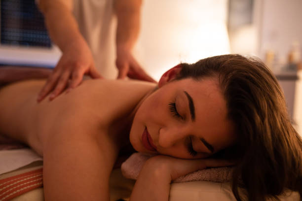 istock A beautiful woman relaxed during a massage 1255775649