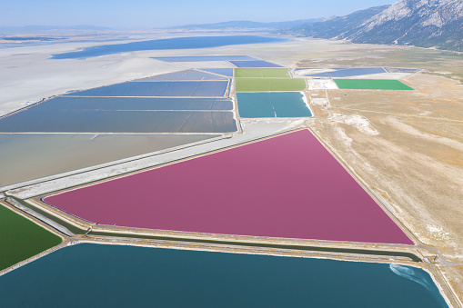 Aerial view of colorful Aquaculture ponds. Taken via drone. Acigol Lake ( Acı Göl) in Turkey.