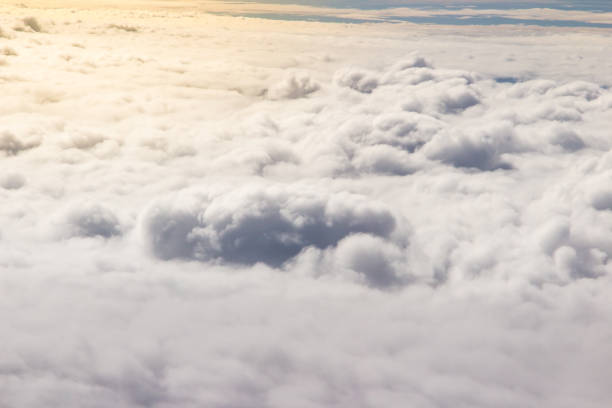 istock Beautiful cloudscape and blue sky from aerial view, nature view from above the sky and clouds. White clouds and blue sky view like the heaven from airplane window. Sunlight in the sky shines on clouds 1255776796