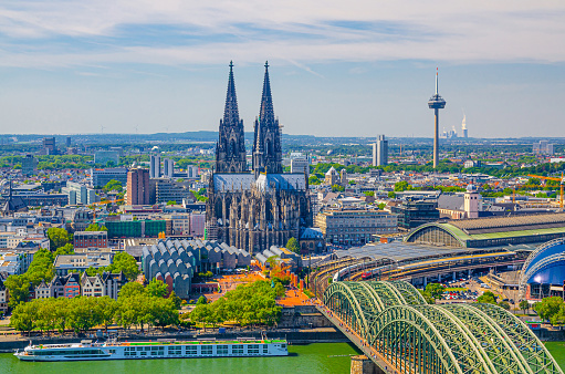 Aerial view of Cologne cityscape of historical city centre with Cologne Cathedral, central railway station Hauptbahnhof and Hohenzollern Bridge across Rhine river, North Rhine-Westphalia, Germany