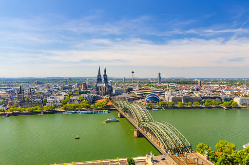 Aerial panoramic view of Cologne cityscape of historical city centre with Cathedral, central railway station Hauptbahnhof and Hohenzollern Bridge across Rhine river, North Rhine-Westphalia, Germany