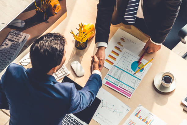 istock Group business people handshake at meeting table 1255781071