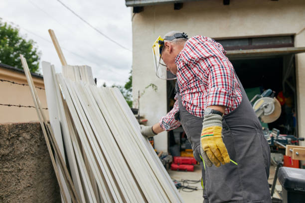 istock Active senior carpenter in coveralls working with timbers at his workshop at backyard 1255785915