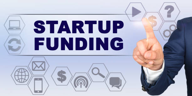 istock Businessman touching virtual screen with his finger. Screen caption - STARTUP FUNDING 1255786131