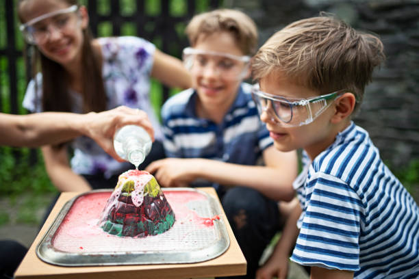 Family testing volcano school project in back yard Family testing science school project . Mother is pouring vinegar into the volcano.
BMPCC4K school science project stock pictures, royalty-free photos & images