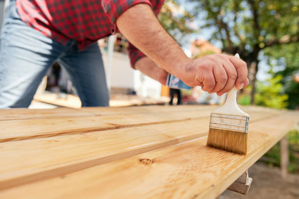 istock One more layer of protective varnish and this fence is almost done 1255788048