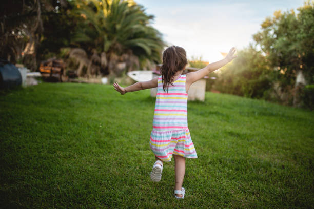 istock Running into the World with wide hands 1255788241