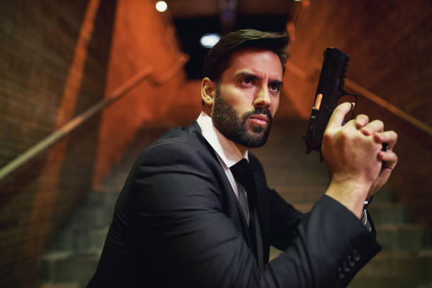 istock Suspicious security guard observing the movement he just saw 1255788312