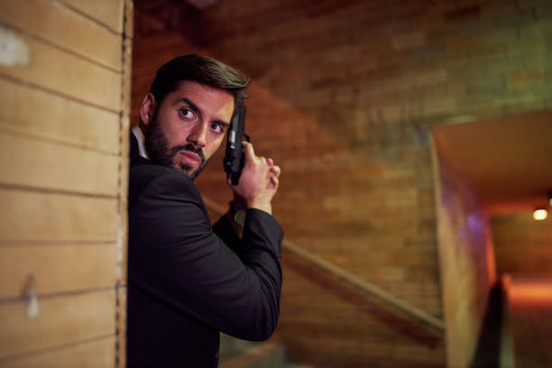 istock Special security agent waiting in ambush for a criminal 1255788353