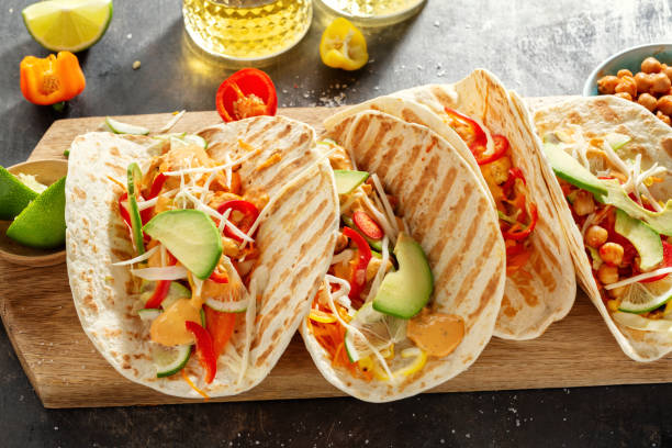 istock Fresh homemade appetizing vegan tacos 1255790280
