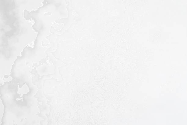 istock Monochromatic wavy and cloudy layout on solid sheet of wallpaper 1255790322