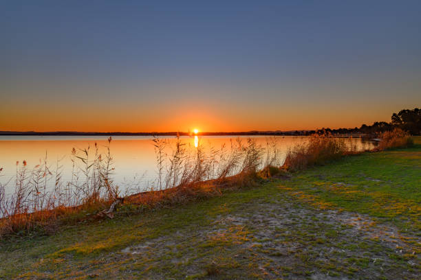 istock Sunset over the Lake with Clear Skies 1255793512