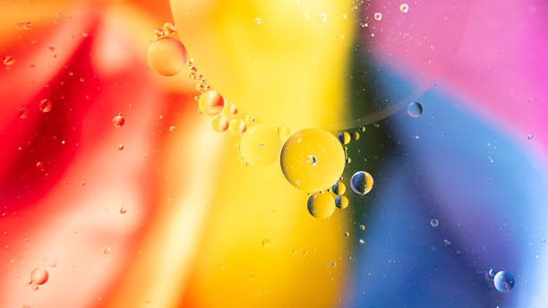 istock Fantastic structure of colorful oil bubbles. Chaotic motion. Abstract paint. Flat lay. Movement of bubbles in the liquid. Water surface multicolored background. Macro Pattern, design. Rainbow, LGBT 1255793791