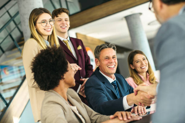 istock Group of business people handshake at the office 1255794776