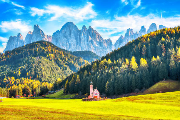 istock Majestic scenery in Dolomites with the St. John's in Ranui Chapel. 1255795746