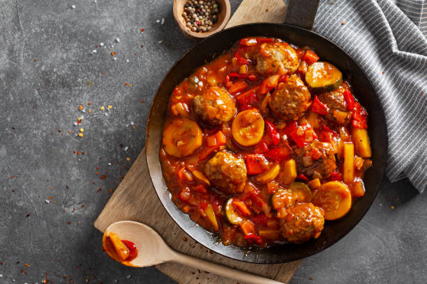 istock Meatballs with vegetables served on pan 1255796788