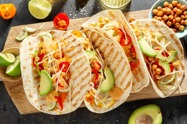 istock Fresh homemade appetizing vegan tacos 1255797612
