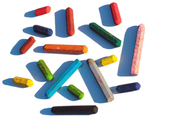 istock Old wax crayons, isolated against white background 1255797769