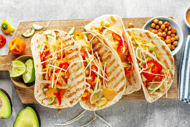 istock Fresh homemade appetizing vegan tacos 1255799267