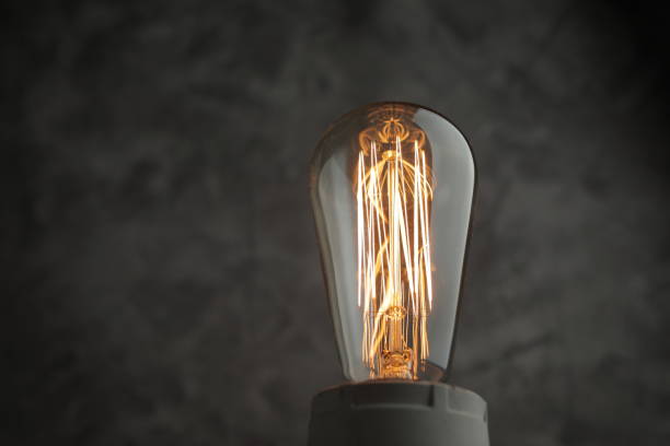 istock Retro lamp with Edison lamp on concrete. A good idea 1255799789